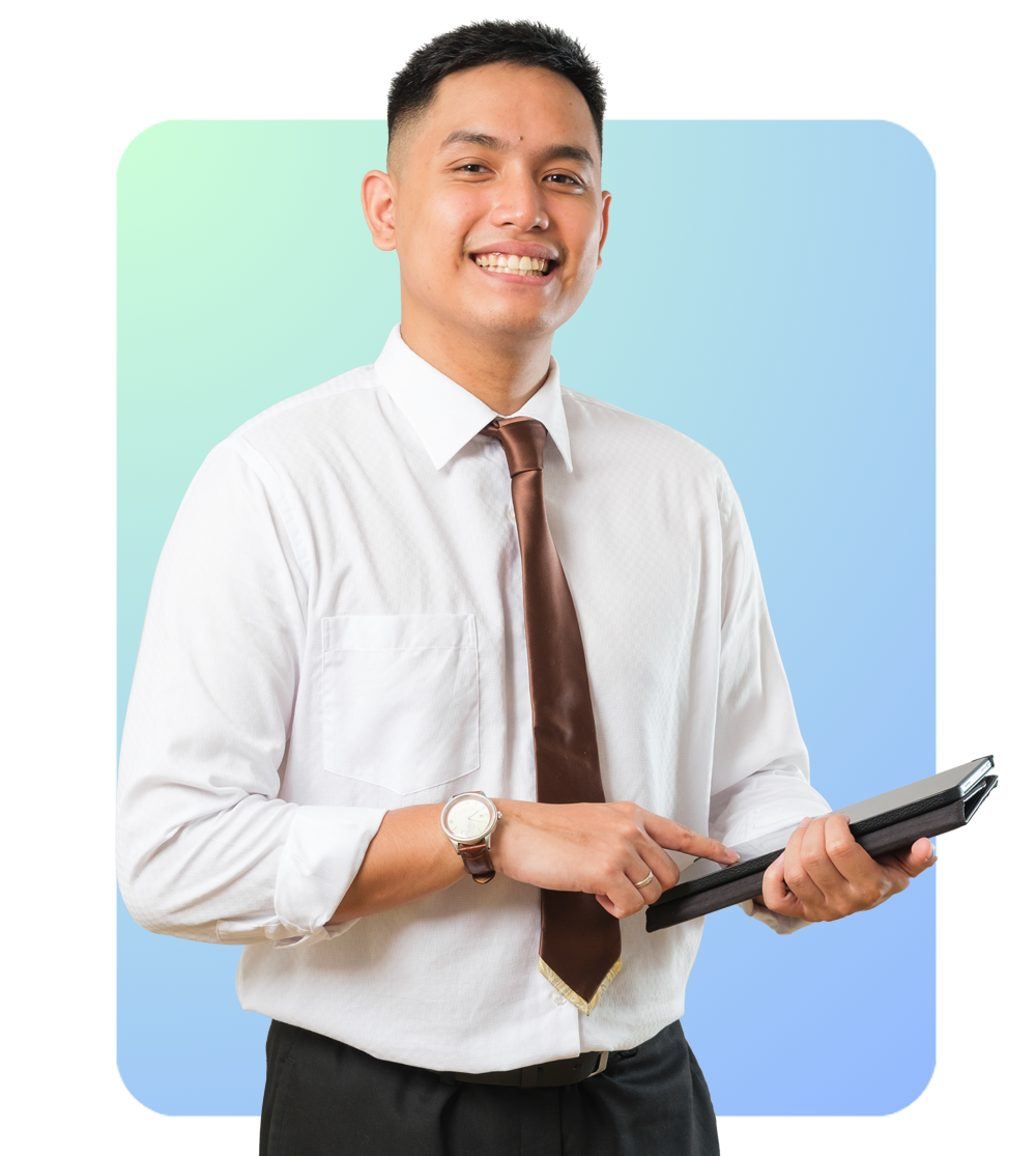 Man Standing and smiling holding his tablet while other hand is pointing to it.